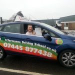 Abby holding his certificate after passing his driving test with High Performance Driving School