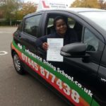 Emma holding her certificate after passing her driving test with High Performance Driving School