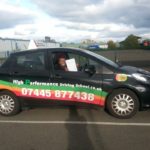 Josephine holding her certificate after passing her driving test with High Performance Driving School