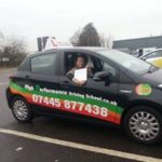 Marteen holding his certificate after passing his driving test with High Performance Driving School